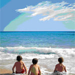 Three children sitting in the water at the beach