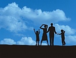 Silhouette of family against blue sky