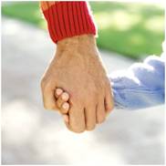 An old man holding a child's hand