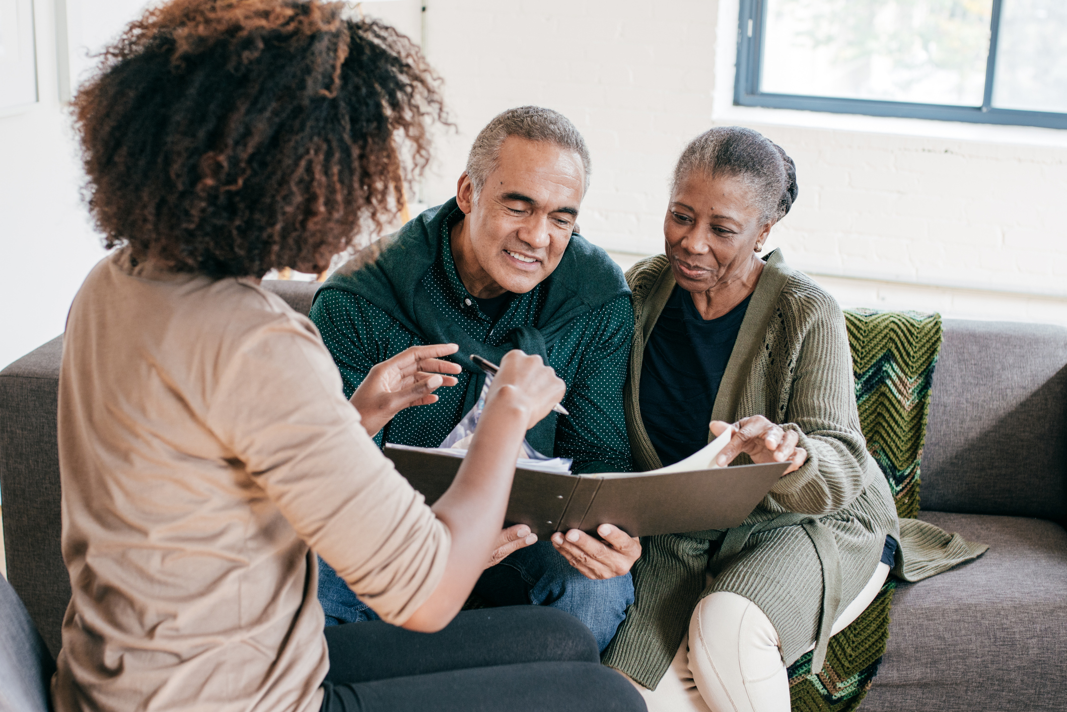 Elderly couple discussing why incapacity planning is important for their estate plan.