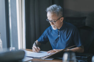 Older man working on estate planning documents