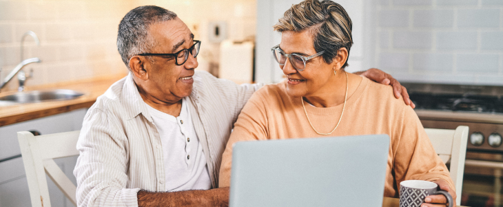 An elderly couple on the computer
